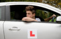 Young man learning to reverse car